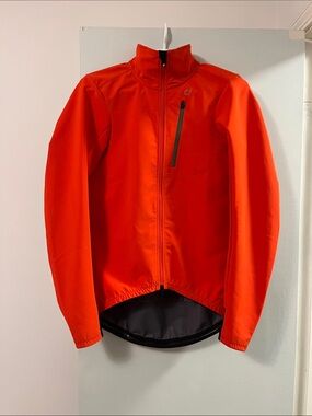 Velocio Men's Softshell cycling Jacket. Chest pocket and 3 deep back pockets.